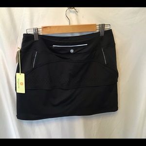 NWT Tangerine skort, dark grey, laser cutouts, SM